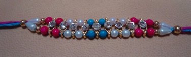 Dual Colored Rakhi in Turquoise & Amethyst With Clear Crystals By Teknowear