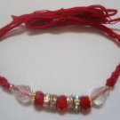 Rakhi in Glass Pearl With Coral & Crystal Clear Stones By Teknowear