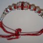 Silver Rakhi in Ruby Red Crystals By Teknowear