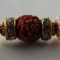 Aru Rakhi In Gold Tone Clear Crystals With Rudraksh & Natural Pearl By Teknowear