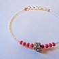 Fuchsia Gold Crystal Rakhi/Bracelet With Ivory Beads By Teknowear