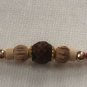 Rudraksha Rakhi With Turmeric & Basil Beads by Teknowear