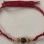 Rudraksha Rakhi With Turmeric & Basil Beads by Teknowear