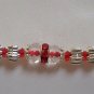 Rakhi in Silver With Glass Beads & Red Crystals By Teknowear