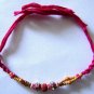 Rudraksh Rakhi With Turmeric Beads By Teknowear