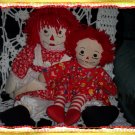 Two Raggedy Ann Dolls