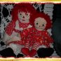 Two Raggedy Ann Dolls