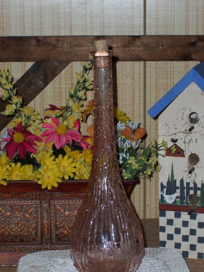 Old Bottle with Dripping Candle Look