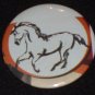 Horse artwork on a badge, pin H 0010