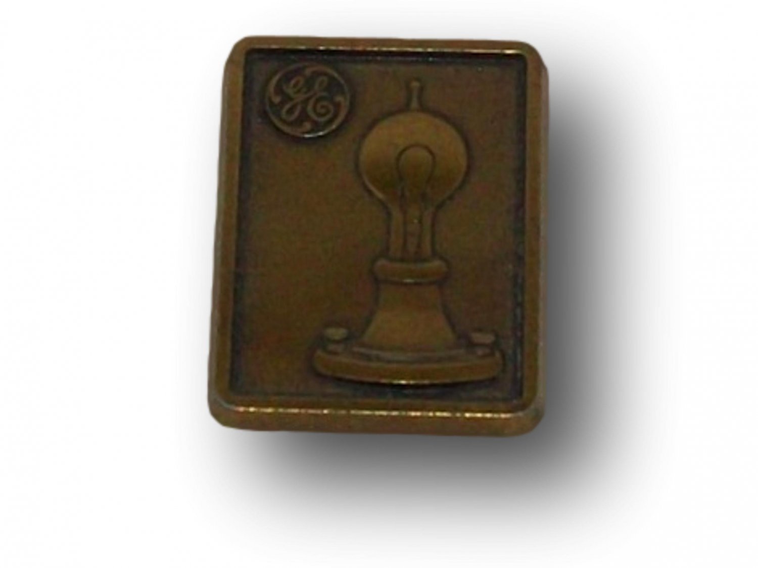 G.E. Logo Metal Badge With a Light Fixture and Bulb