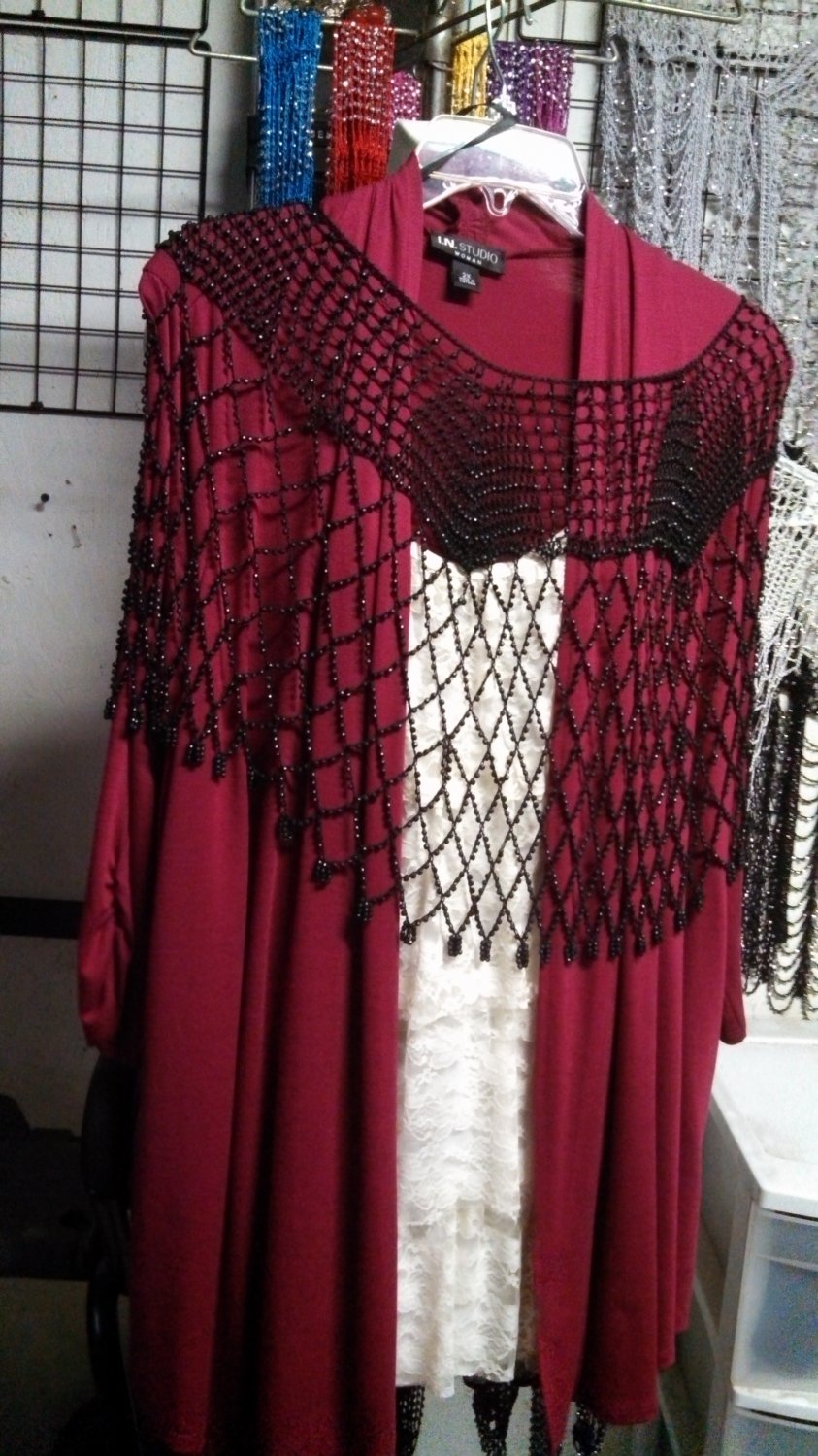 Crochet beaded poncho with silver beads great for casual or formal wear