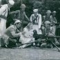 Anne Shirley and James Craig taking lesson for operating M2 Browning machine gun