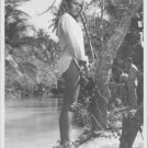 Ursula Andress standing on lakeshore.  - 8x10 photo