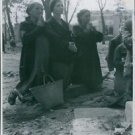 Women kneeling and praying, weeping in Poland, 1939. - 8x10 photo