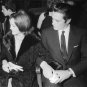 Alain Delon sitting close with a woman. - 8x10 photo