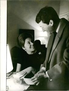 Philippine de Rothschild, showing her ring, with Jacques Sereys. - 8x10 photo