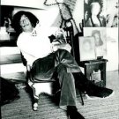 Salvador Dali sitting on chair.   - 8x10 photo