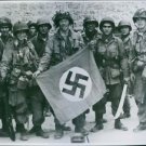 U.S. soldiers holding a German flag. 1944. - 8x10 photo