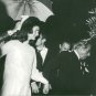 Aristotle Onassis holding hand of Jacqueline Kennedy. - 8x10 photo