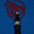 DAZZLING AND WONDERFUL AUTHENTIC NEW ORLEANS MARDI GRAS COCA-COLA BOTTLE BEAD DAZZLING AND WONDERFUL AUTHENTIC NEW ORLEANS MARDI GRAS COCA-COLA BOTTLE BEAD
