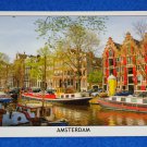 BRAND NEW CAPTIVATING GREETINGS FROM AMSTERDAM POSTCARD CANAL BOATS ARCHITECTURE