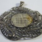 Old silver pendant for a photo