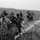 Vietnamese Rangers Rush Chidren To Waiting Helicopter April 1974 B&W Poster