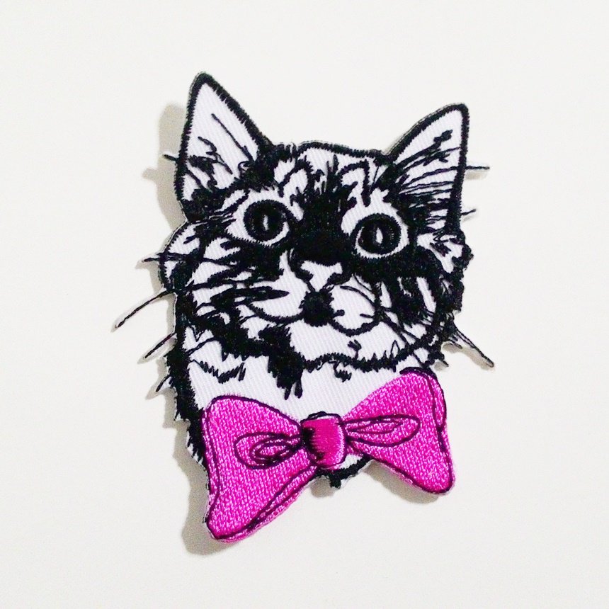 Cat cartoon with pink ribbon embroidered iron on patch.