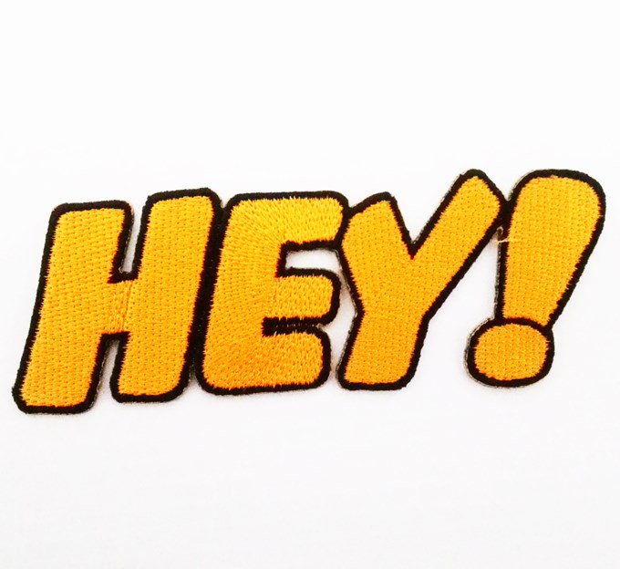 Hey! text embroidered iron on patch.