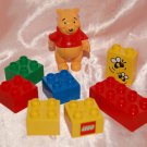 USED Winnie The Pooh Figure & 7 pieces Lego Building Blocks