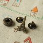 Eiffel Tower brass effect snap buttons set