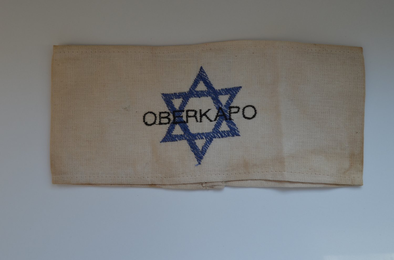 WWII THE JEWISH ARMBAND WITH THE CONCENTRATION CAMP OBERKAPO