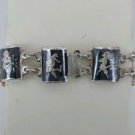 Vintage collectible 925 sterling silver Siam bracelet Thai idols on black enamel