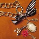 PARISENNE CHARM BRACELET EIFFEL TOWER,SHIPS WHEEL,TASSEL,CABACHON
