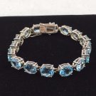 SKY BLUE TOPAZ CUT OVALS (16) SET IN STERLING SILVER 925 TENNIS BRACELET 8"