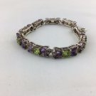 SILVER TONE PERIDOT AND AMETHYST TENNIS BRACELET 7"