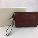 COACH BROWN LEATHER WRISTLET