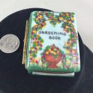 LIMOGE GARDENING BOOK W/ TOOLS TRINKET BOX WITH GOLD TRIM DETAIL