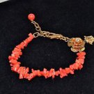 VERSACE GOLD TONE CORAL BEADED FLOWER DETAIL BRACELET