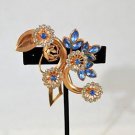 COPPER TONE BLUE AND CRYSTAL STONE FLORAL BROOCH