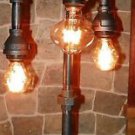 Handcrafted Industrial Pipe Three Tier Lamp steampunk style with vintage bulb