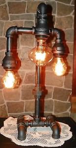 Handcrafted Industrial Pipe Three Tier Lamp steampunk style with vintage bulb