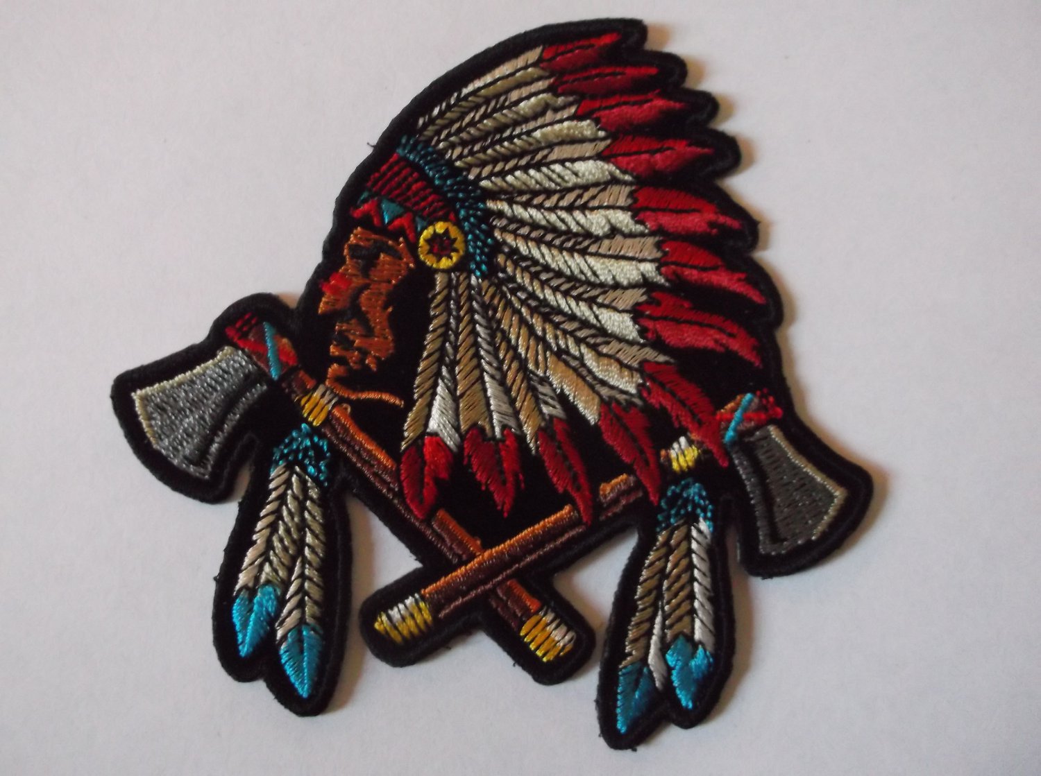 INDIAN HEAD AND HEADDRESS AND BATTLE AXES PATCH