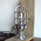 Driftwood and polished metal nautical table light bulkhead cage light