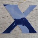 FUNKY BLUE PLASTIC "X" FROM A SHOP SIGN