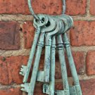 BEAUTIFUL SET OF LARGE CAST IRON ANTIQUE STYLE KEYS ON KEY RING VERDIGRIS FINISH