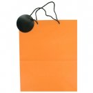 Orange gift bag with black tag