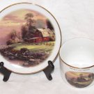 Thomas Kinkade Gold Trimmed Cup and Saucer "Sunset At Riverbend Farm" Display