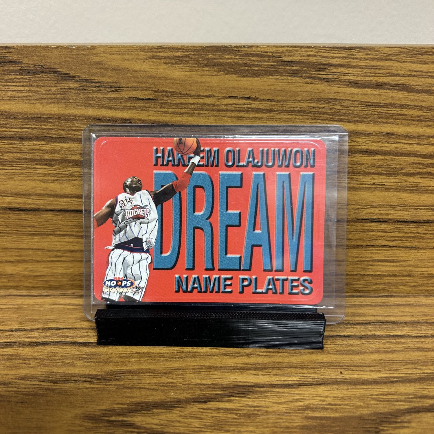 1999 NBA Hoops Skybox Name Plates Hakeem Olajuwon #5 of 10NP