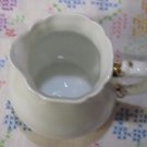 White Creamer with Gold Handled Trim